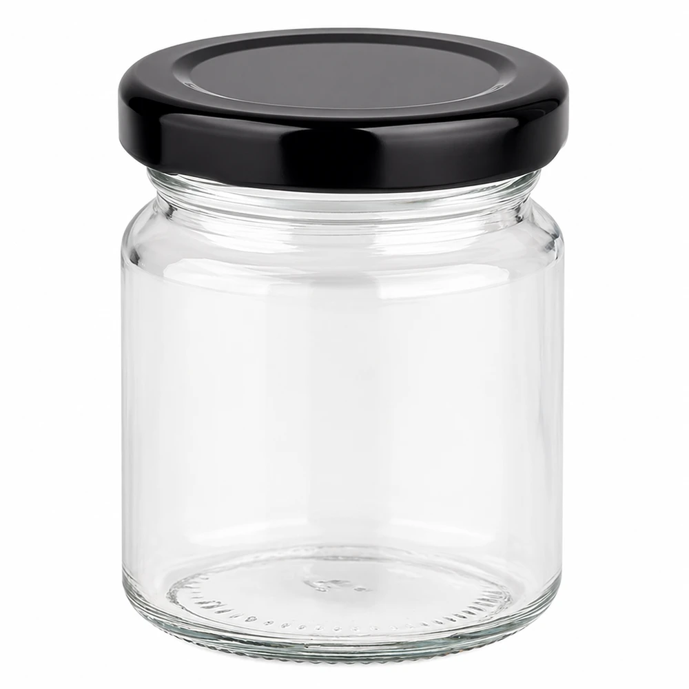 Rund burk 53 ml med lock BasicSeal svart UNiTWIST 53 ml rund burk med svart BasicSeal-lock, tom på vit bakgrund liten glasburk för konservering