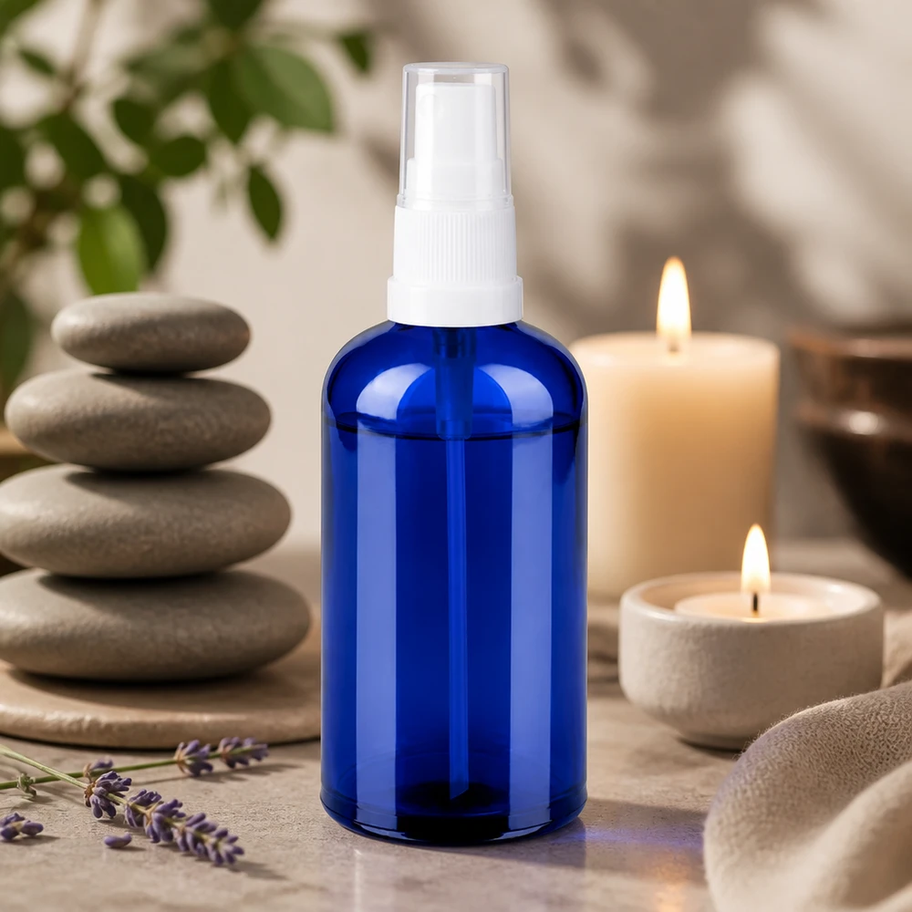 Praktisk 100 ml sprayflaska av robust glas med praktisk pumpspruta för wellness