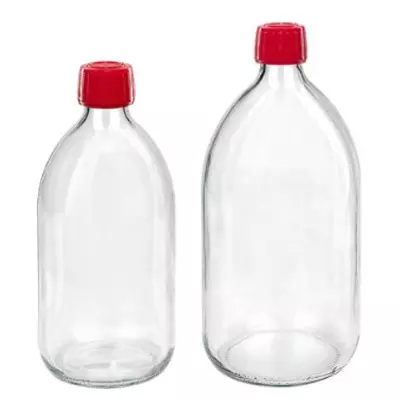 Flacons médicaux clairs avec bouchon rouge
