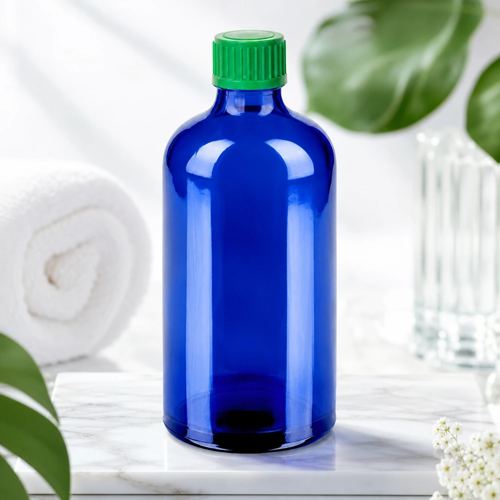Högkvalitativ BlueLine droppflaska 100 ml av mörkblått glas med grönt skruvlock för UV-skydd