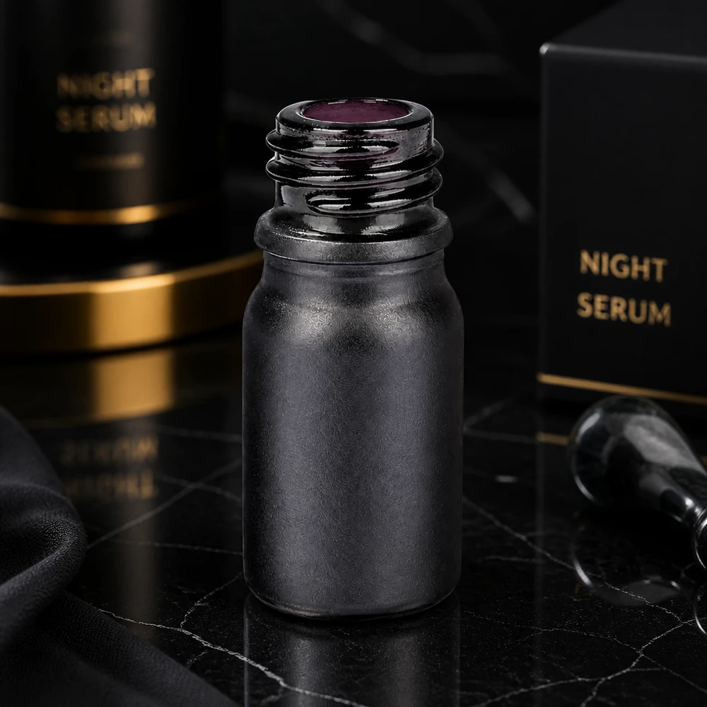 Svart 5ml apoteksflaska BlackLine UT18/5 av violett glas för kosmetika och nattserum