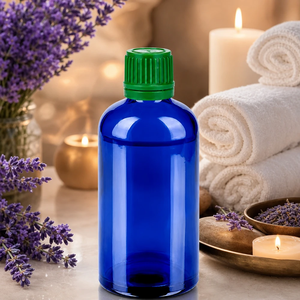 Koboltblå apoteksflaska 100 ml med grönt lock, idealisk för aromaterapi och wellness