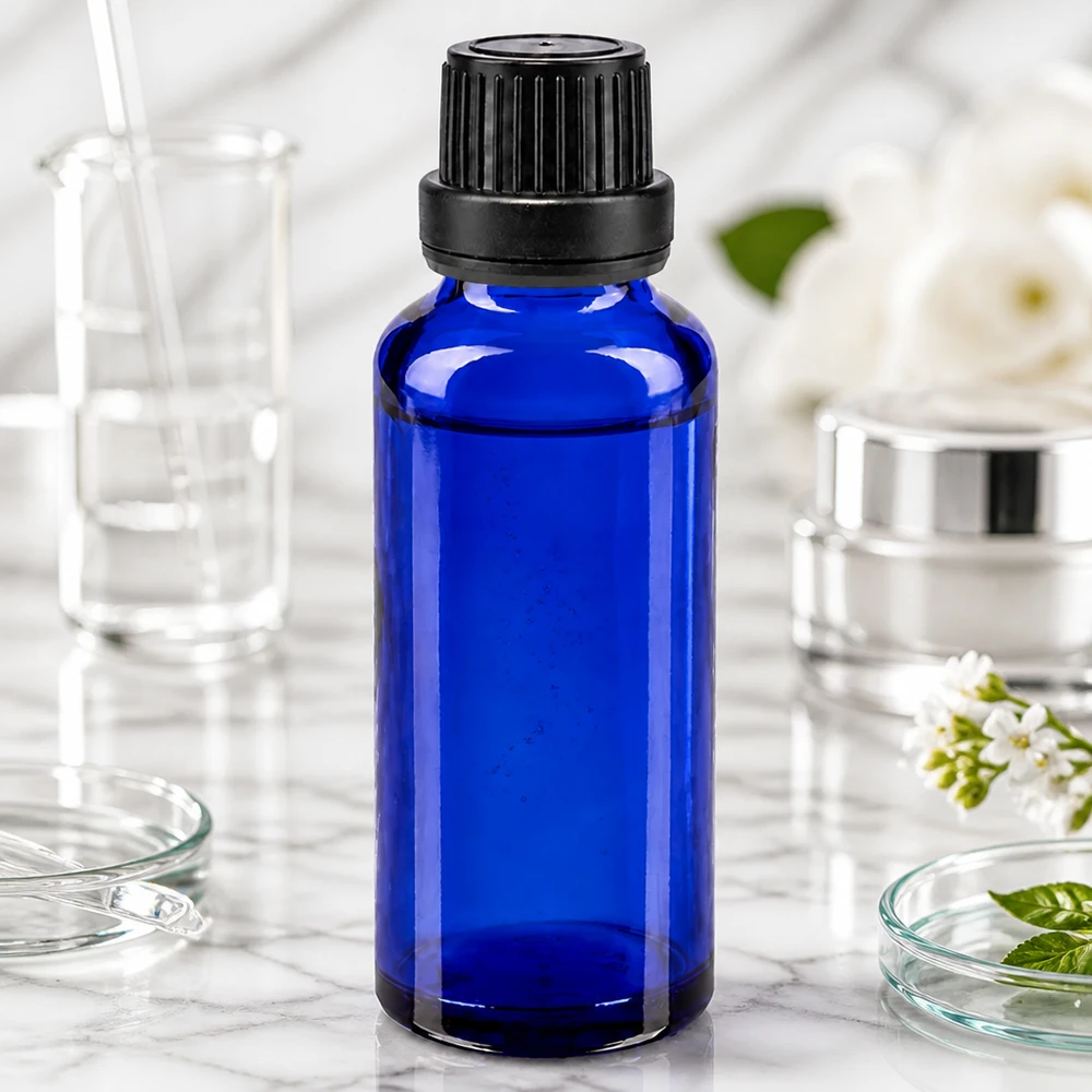 Apoteksflaska blå 30ml skruvkork svart manipuleringssäker förslutning Mörkblå 30 ml droppflaska av apotekerglas med barnsäker skruvkork, 11 mm