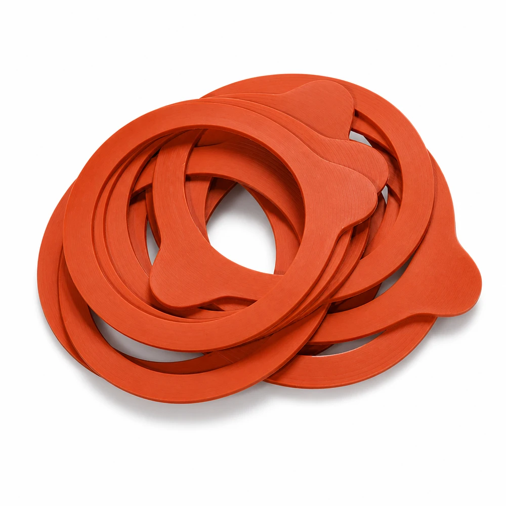 Konserveringsring naturgummi RR60 Konserveringsringar RR60 naturgummi orange staplade nästlade Närbild av gummitätningar Konserveringsburkar