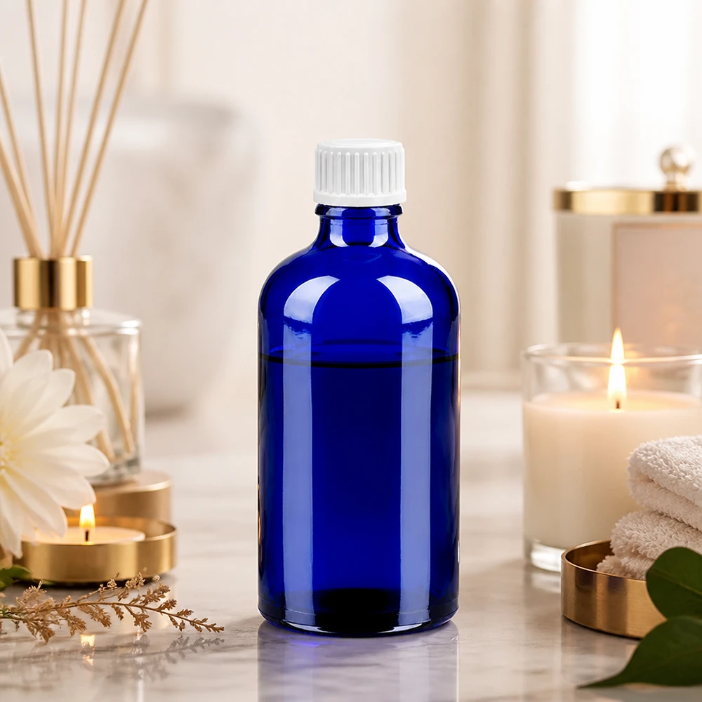 100 ml droppflaska 0,9 mm vit med standardförslutning BlueLine UT18/100 Elegant blå glasflaska 100 ml med vitt dropplock för aromaterapi och eteriska oljor