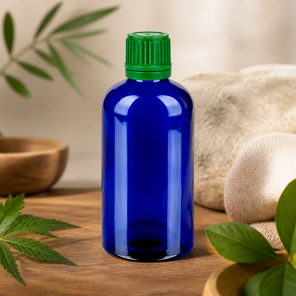 100 ml flaska i lysande koboltblå med säkert grönt lock för naturkosmetika och tinkturer