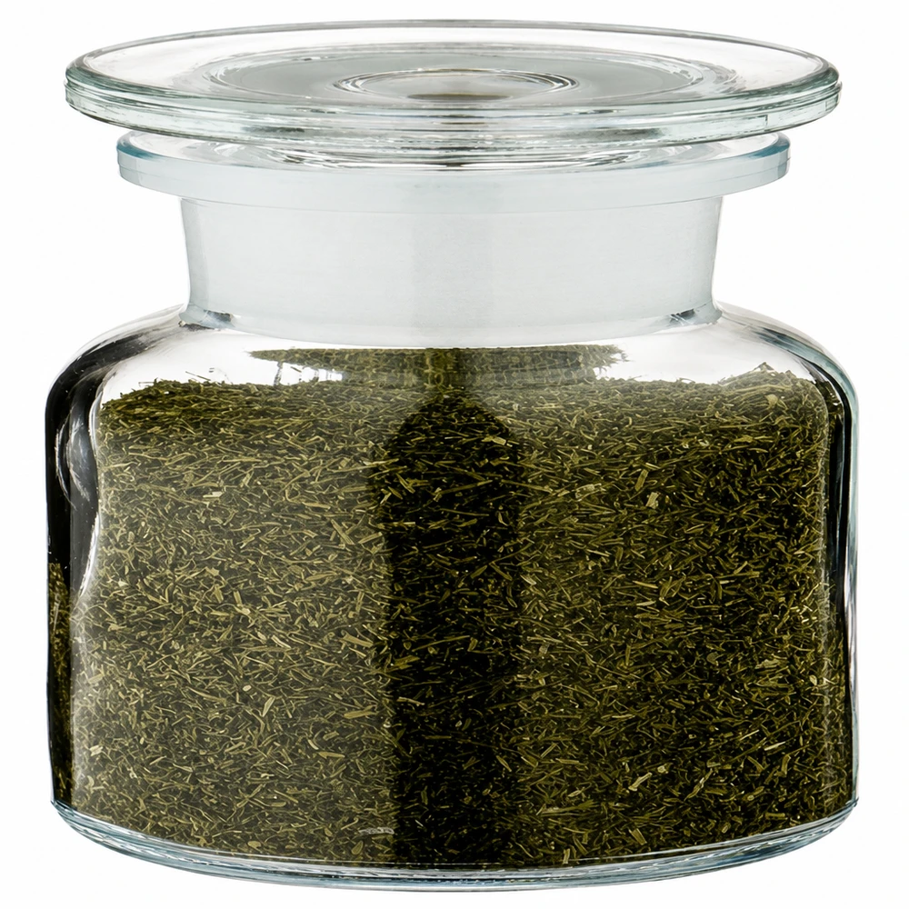 Idé för ett kryddburk i glas: Apotekarflaska 100 ml med vid hals, klart glas, inkl. glaspropp Apoteksflaska, 100 ml, vid hals, klart glas, fylld med grönt örtte och glaslock