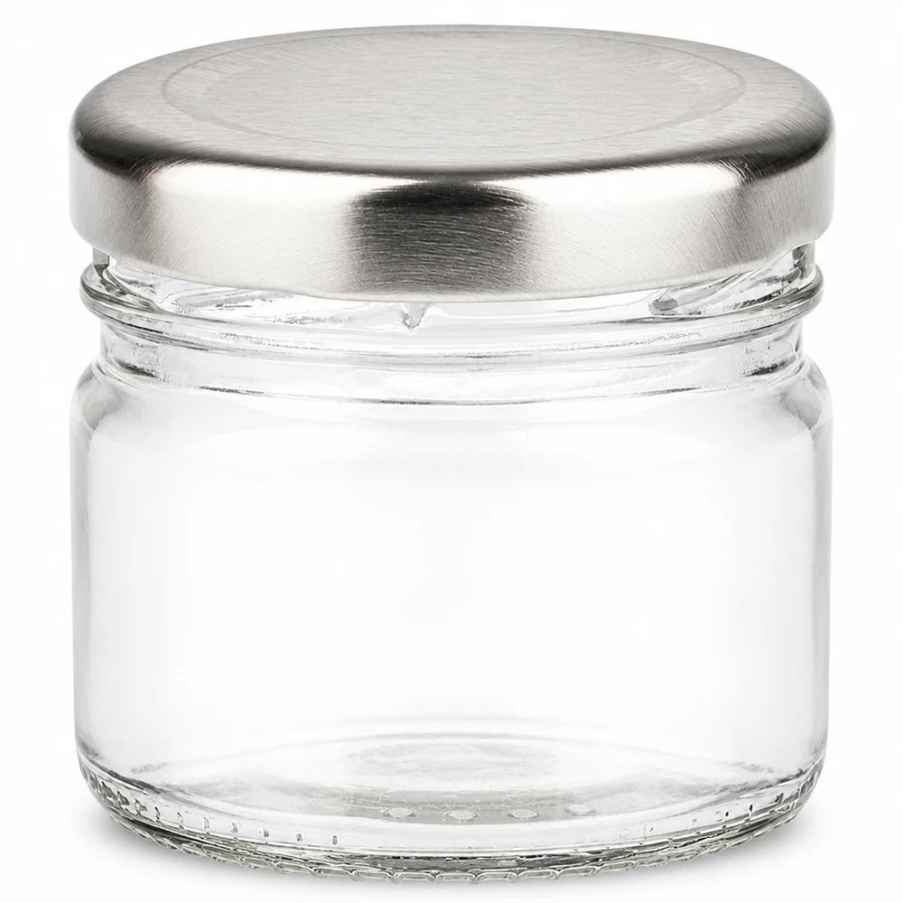 33 ml rund glasburk + BasicSeal-lock i silver UNiTWIST Litet runt glas 33 ml med silverfärgat BasicSeal-lock, tomt och genomskinligt sett framifrån