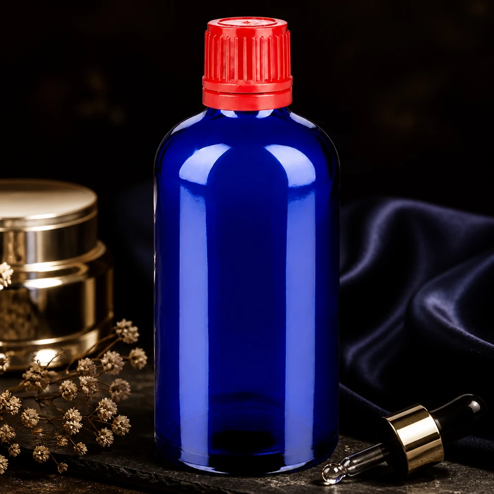 100ml flaska 11mm skruvkork röd säkerhetsförslutning BlueLine UT18/100 Elegant 100 ml BlueLine UT18 droppflaska av koboltglas med röd kapsyl med sabotageskydd