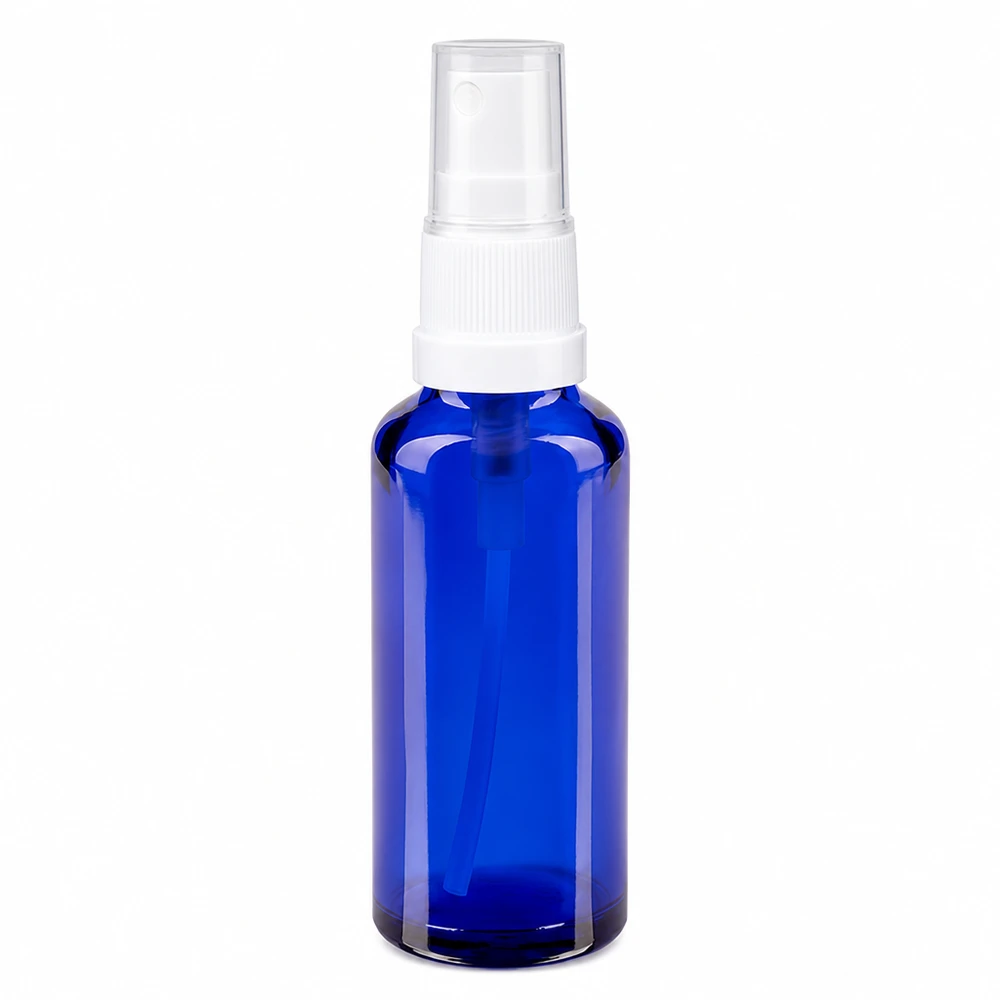 Apoteksflaska blå 30ml spraytopp vit 30 ml sprayflaska av blått apoteksglas med vit pump och genomskinligt skyddslock