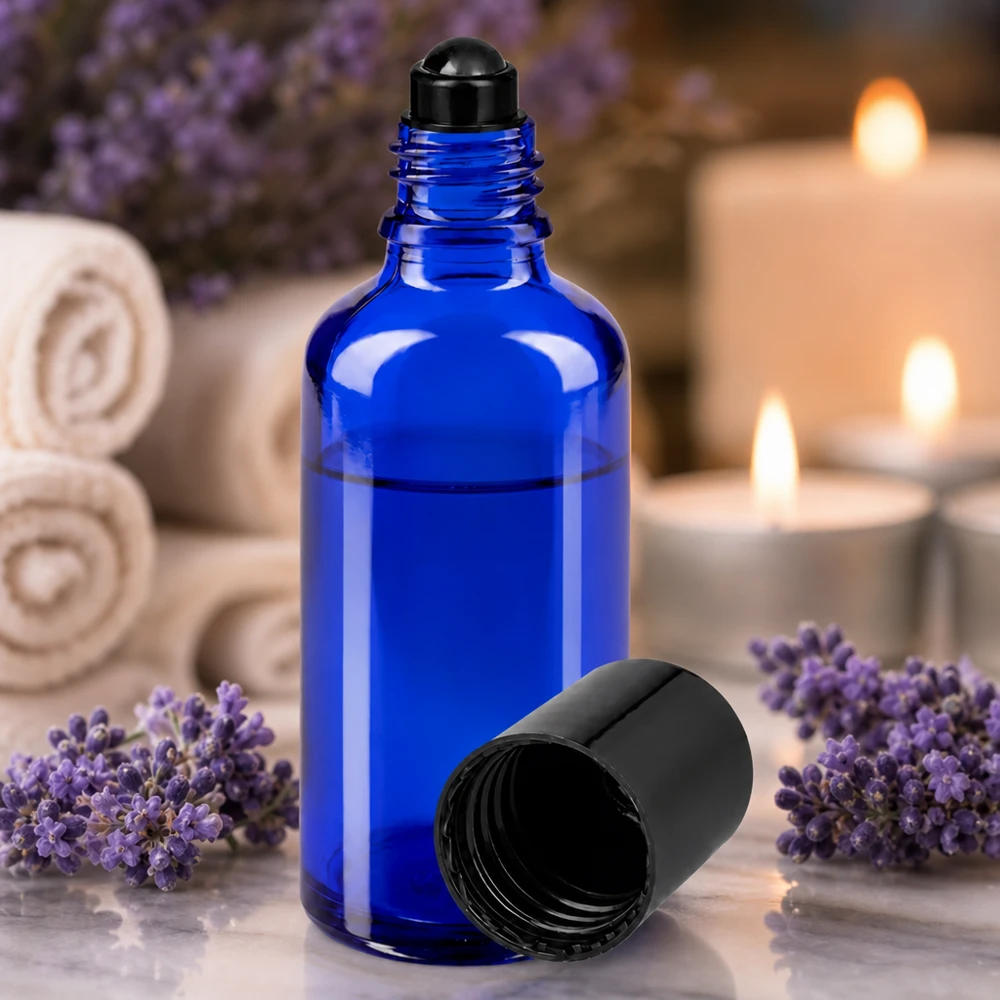50 ml roll-on-flaska av koboltblått skyddsglas med svart kulapplikator för aromaterapi