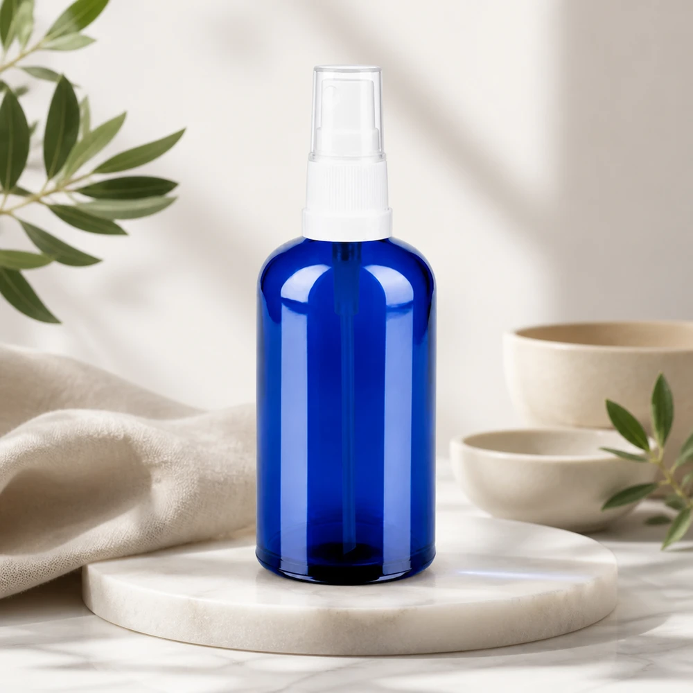 Högkvalitativ 100 ml sprayflaska av blått glas med transparent design för naturlig vård