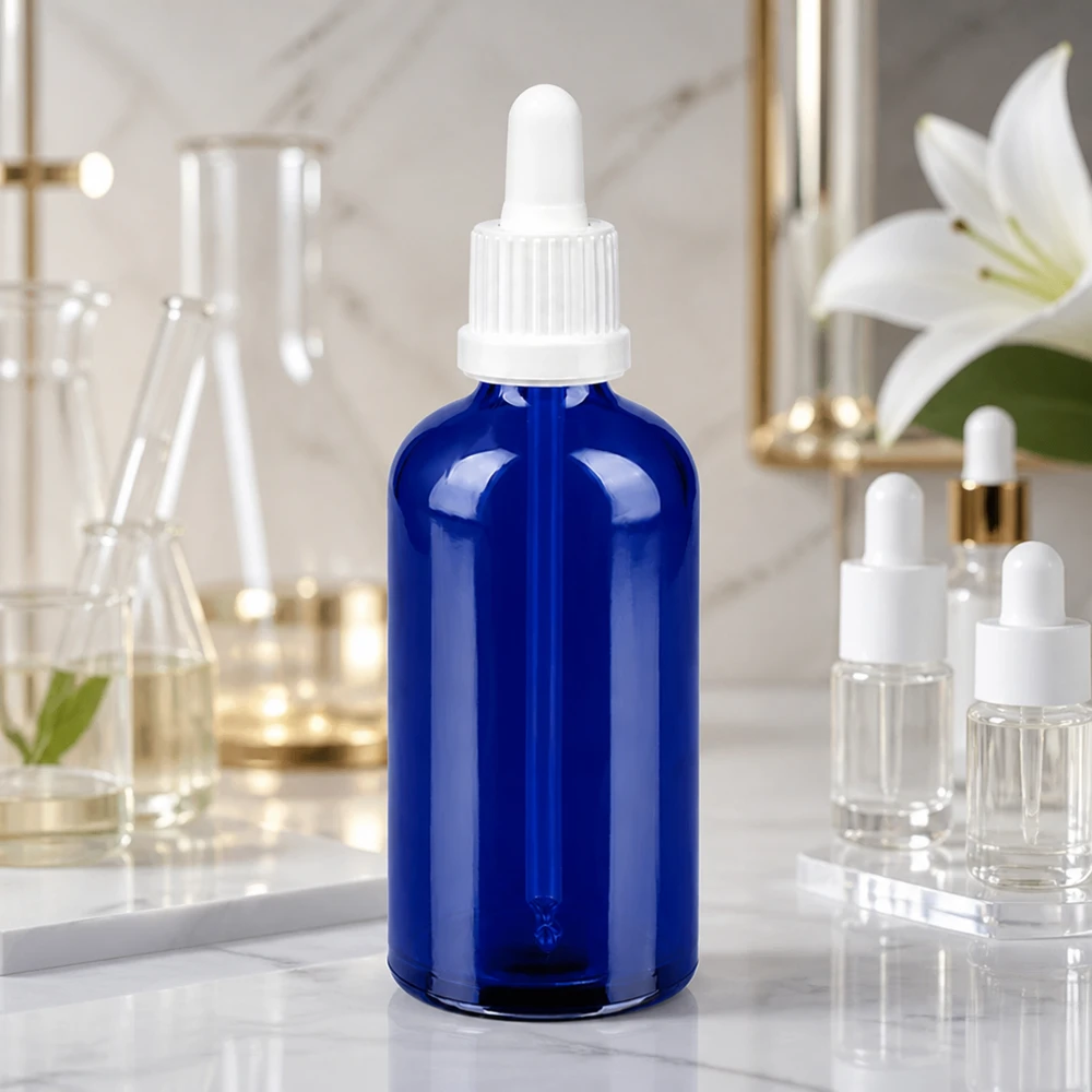 100 ml pipettflaska vit med säkerhetsförslutning BlueLine UT18/100 Elegant 100 ml glasflaska i blått med vit pipett för snygg produktpresentation BlueLine