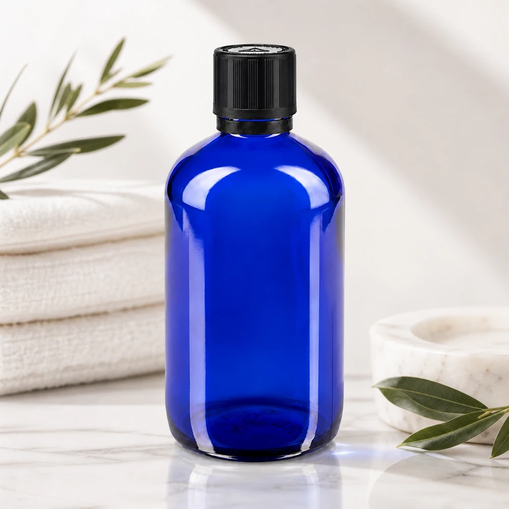 Apoteksflaska blå 100ml dropplock premium 1mm svart barnskyddande manipulationsskyddad förslutning Koboltblå apotekarflaska på 100 ml med svart OV KiSi-lock och en droppinsats i glas på 1 mm