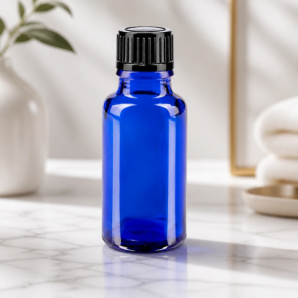 Apoteksflaska blå 20ml droppflaska 1mm svart standard Liten blå droppflaska på 20 ml av apotekerglas med svart skruvlock