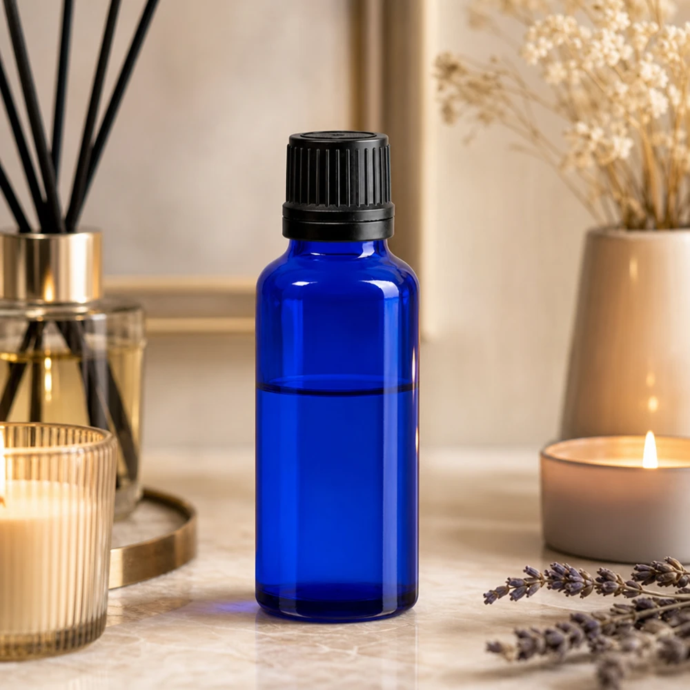 Aromaterapiflaska med droppflaska, 30 ml, i koboltblått skyddsglas med svart OV-lock