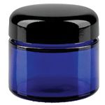 Blå glasburkar med svart lock